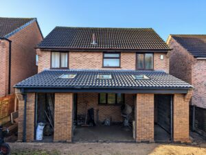 Brick single storey rear extension with pitched roof.