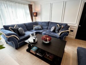 Duresta corner sofa in tiled open plan living area.