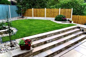 Raised grass landscaping with garden steps.