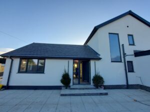 White render Bungalow renovation and double storey side extension.